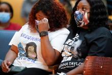 Tamika Palmer, the mother of Breonna Taylor, weeps during a Sept. 15 news conference announcing a $12 million civil settlement between the Taylor's estate and the city of Louisville, Kentucky. (CNS/Reuters/Bryan Woolston)